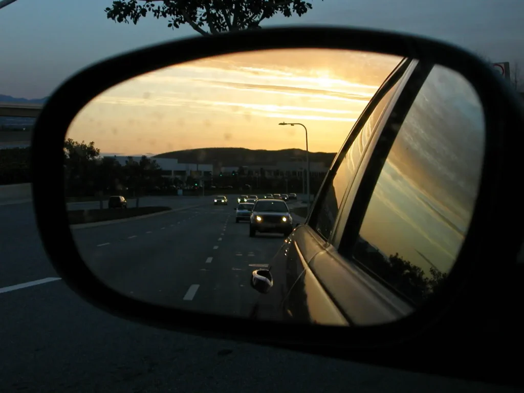 On the road - cars in the side mirror of my car