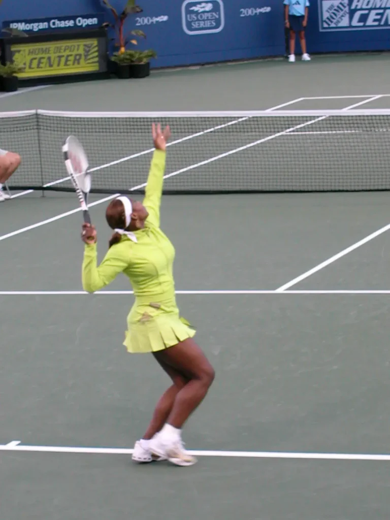 Serena Williams serving in a tennis match
